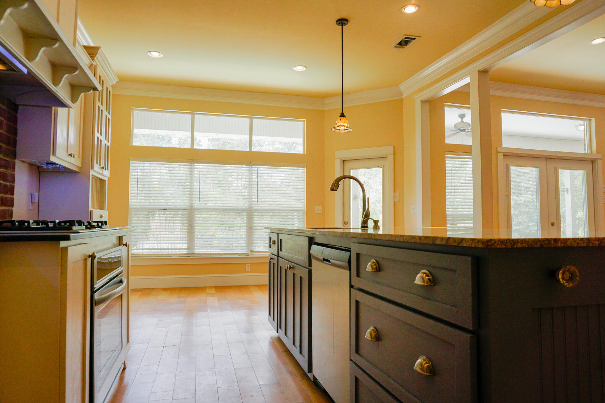 114 Eagle Drive Crestview, FL 32536 - Photo 14 of 63 a open kitchen with stainless steel appliances granite countertop a stove a sink and a refrigerator