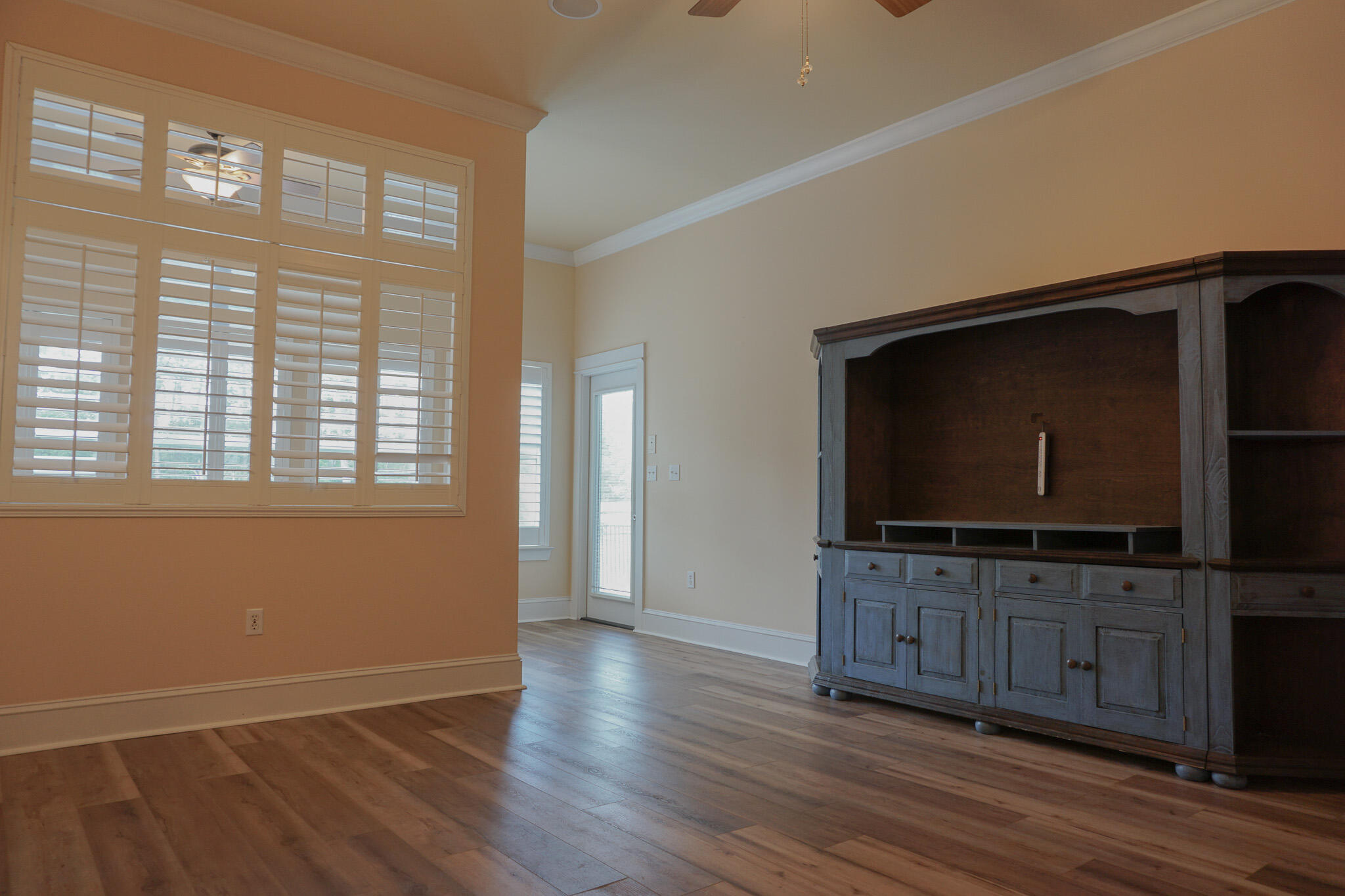 114 Eagle Drive Crestview, FL 32536 - Photo 26 of 63 a living room with wooden floor and flat screen tv