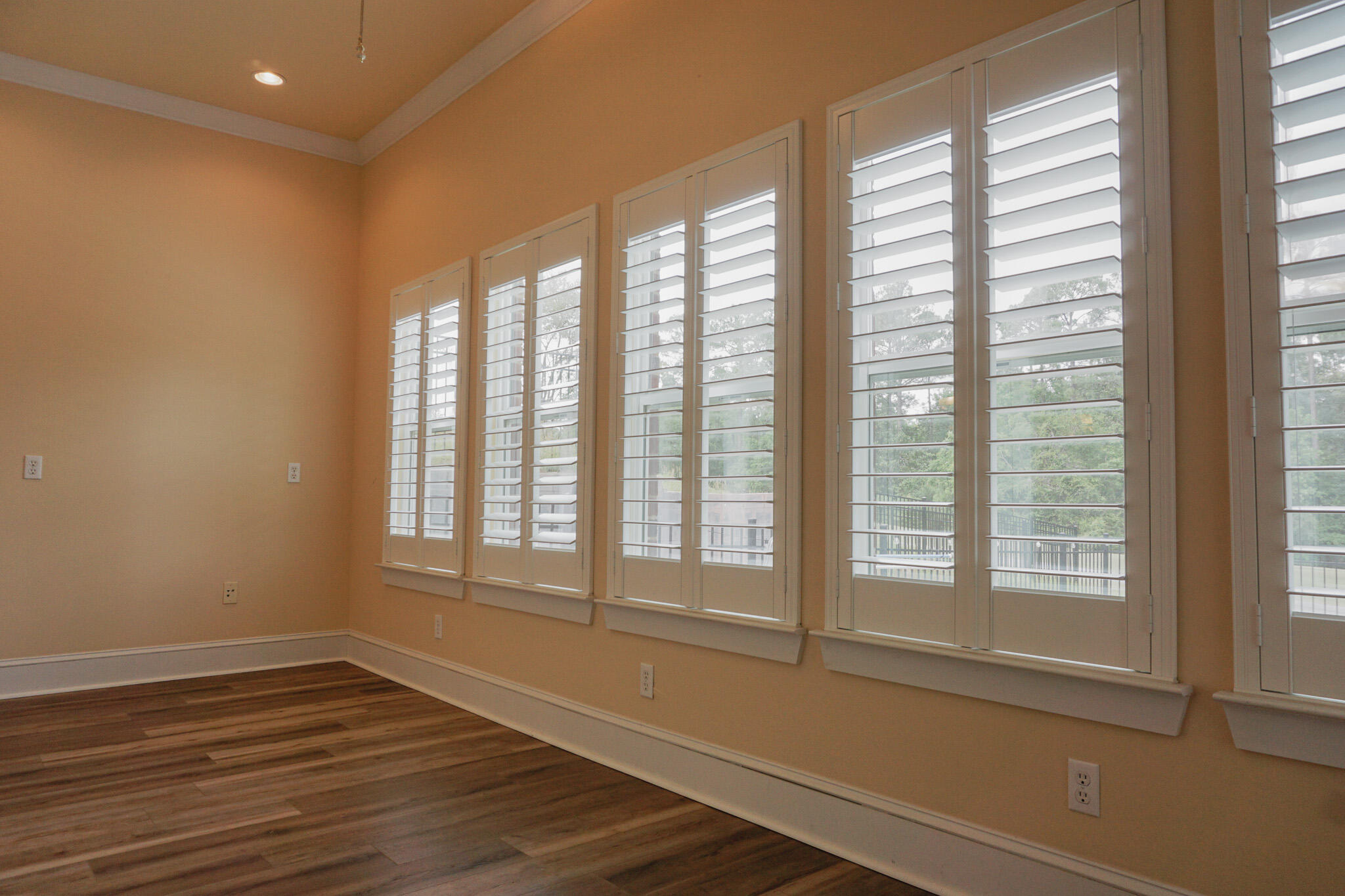114 Eagle Drive Crestview, FL 32536 - Photo 27 of 63 a view of an empty room with wooden floor and a window