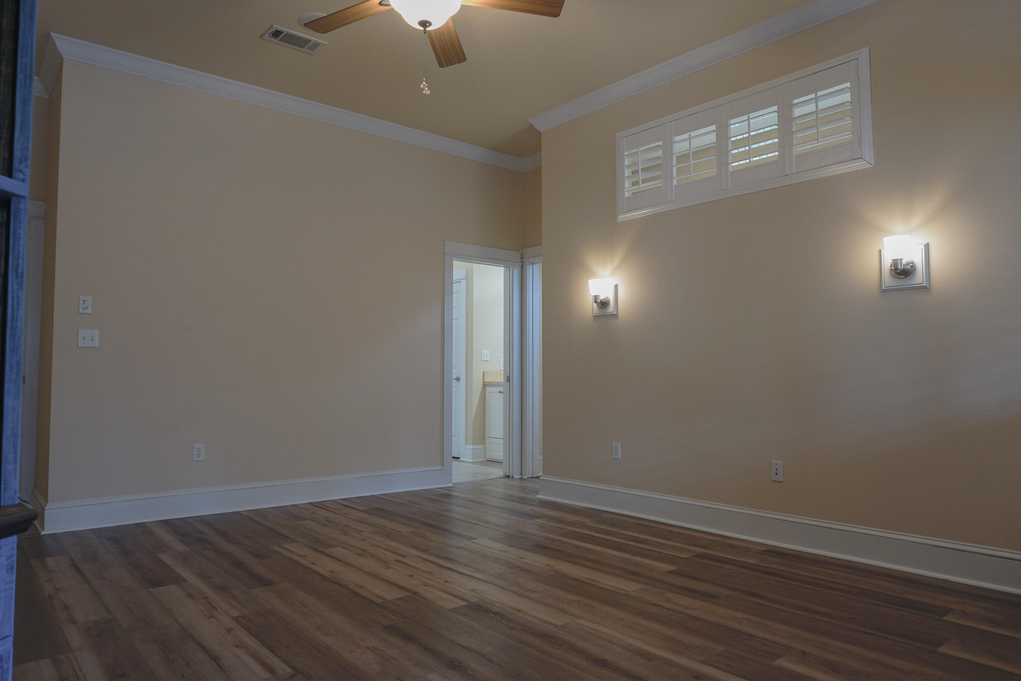 114 Eagle Drive Crestview, FL 32536 - Photo 29 of 63 an empty room with wooden floor and windows