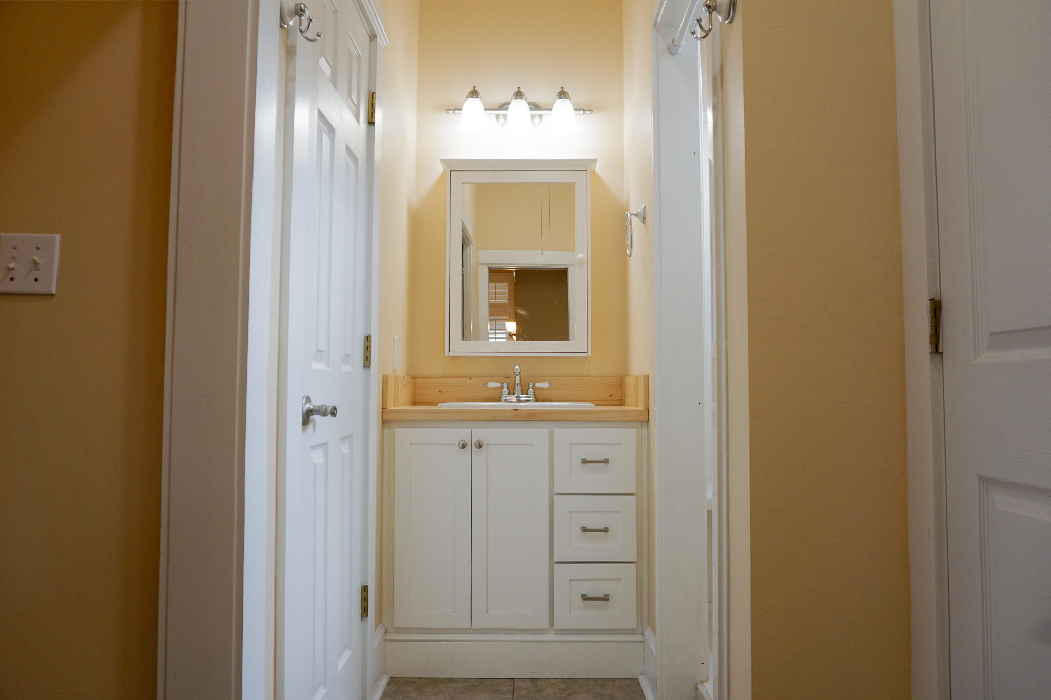 114 Eagle Drive Crestview, FL 32536 - Photo 32 of 63 a bathroom with a sink and a mirror