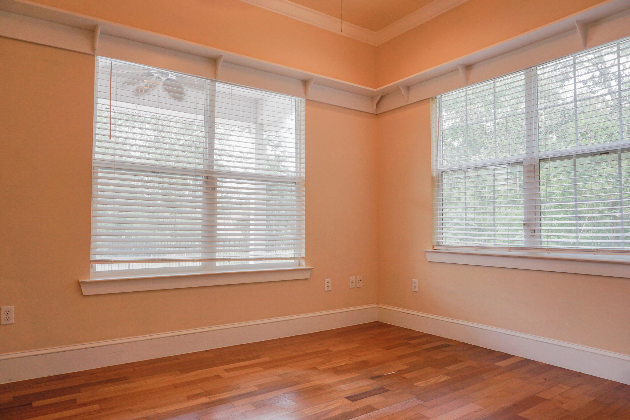 114 Eagle Drive Crestview, FL 32536 - Photo 44 of 63 a view of an empty room with wooden floor and a window