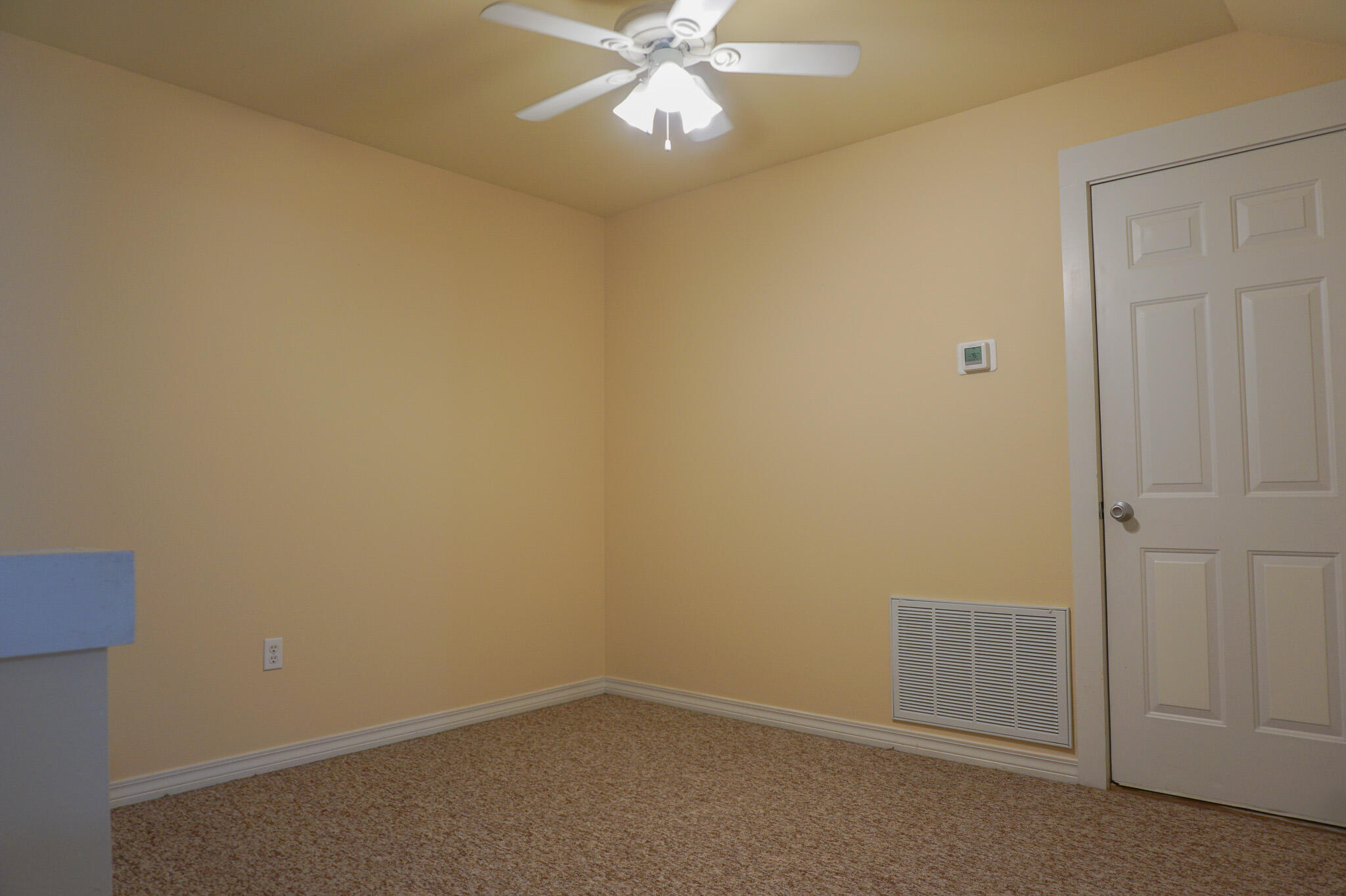 114 Eagle Drive Crestview, FL 32536 - Photo 52 of 63 an empty room with a ceiling fan and a window