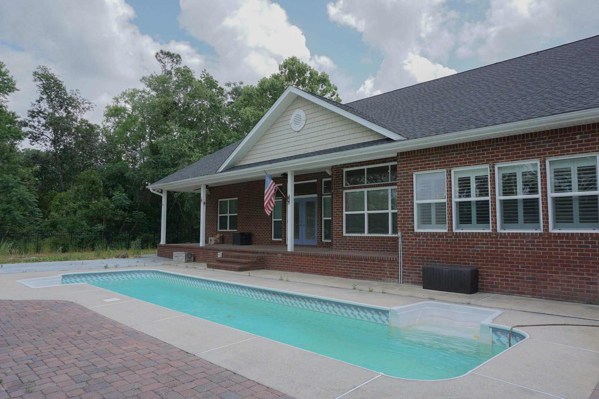 114 Eagle Drive Crestview, FL 32536 - Photo 61 of 63 a front view of a house with a garden and patio