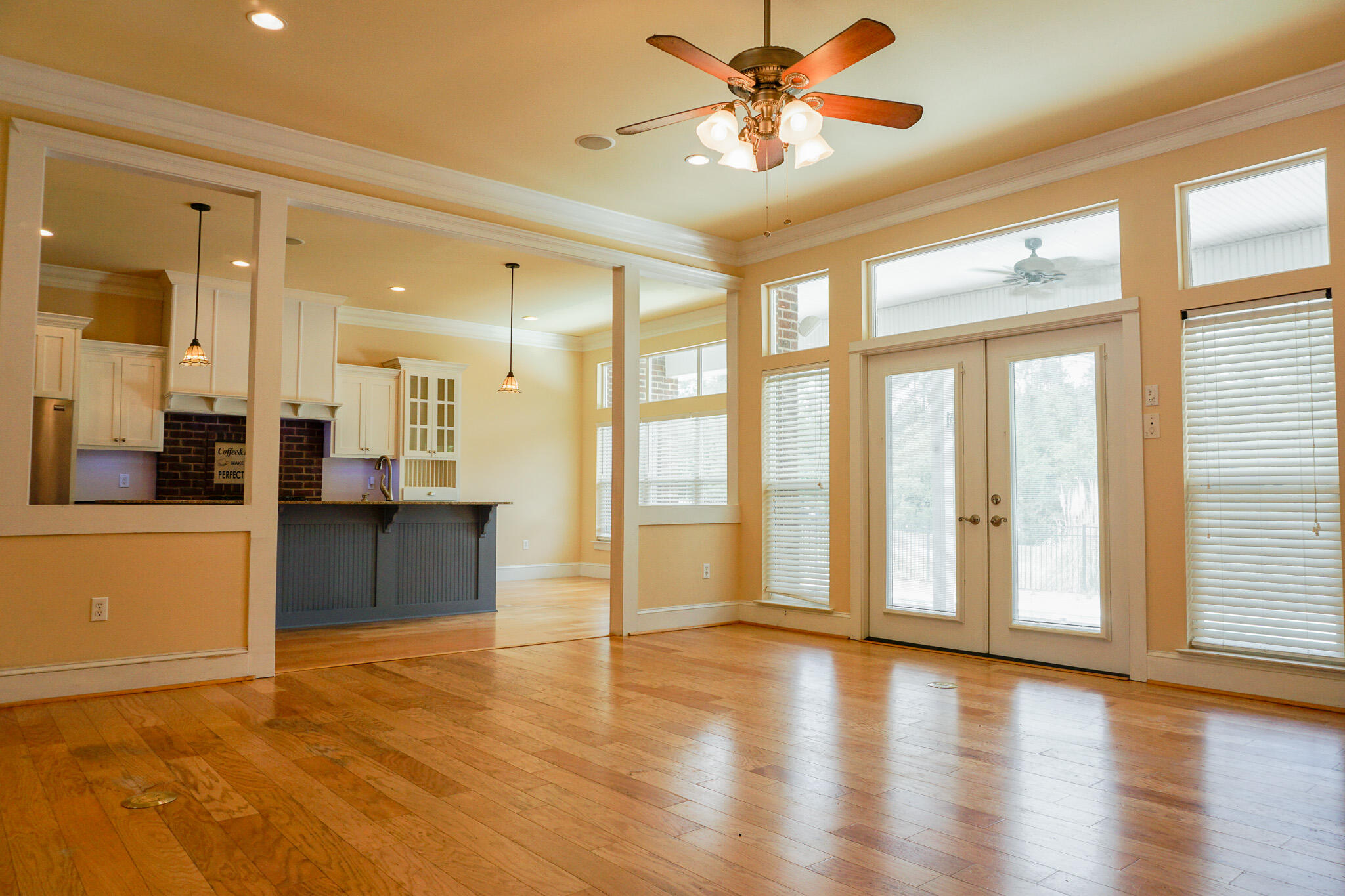 114 Eagle Drive Crestview, FL 32536 - Photo 9 of 63 a view of an empty room with window and wooden floor