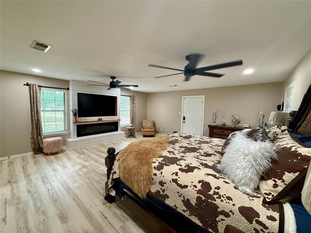 2007 Deep Water Road May, TX 76857 - Photo 10 of 40 a bed room with bed and a flat screen tv