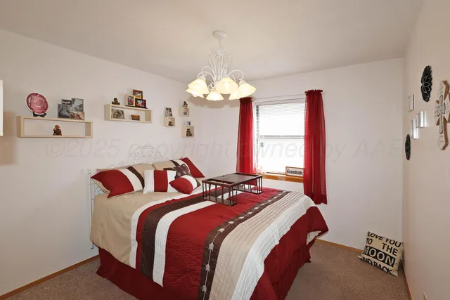 a bedroom with bed and a window