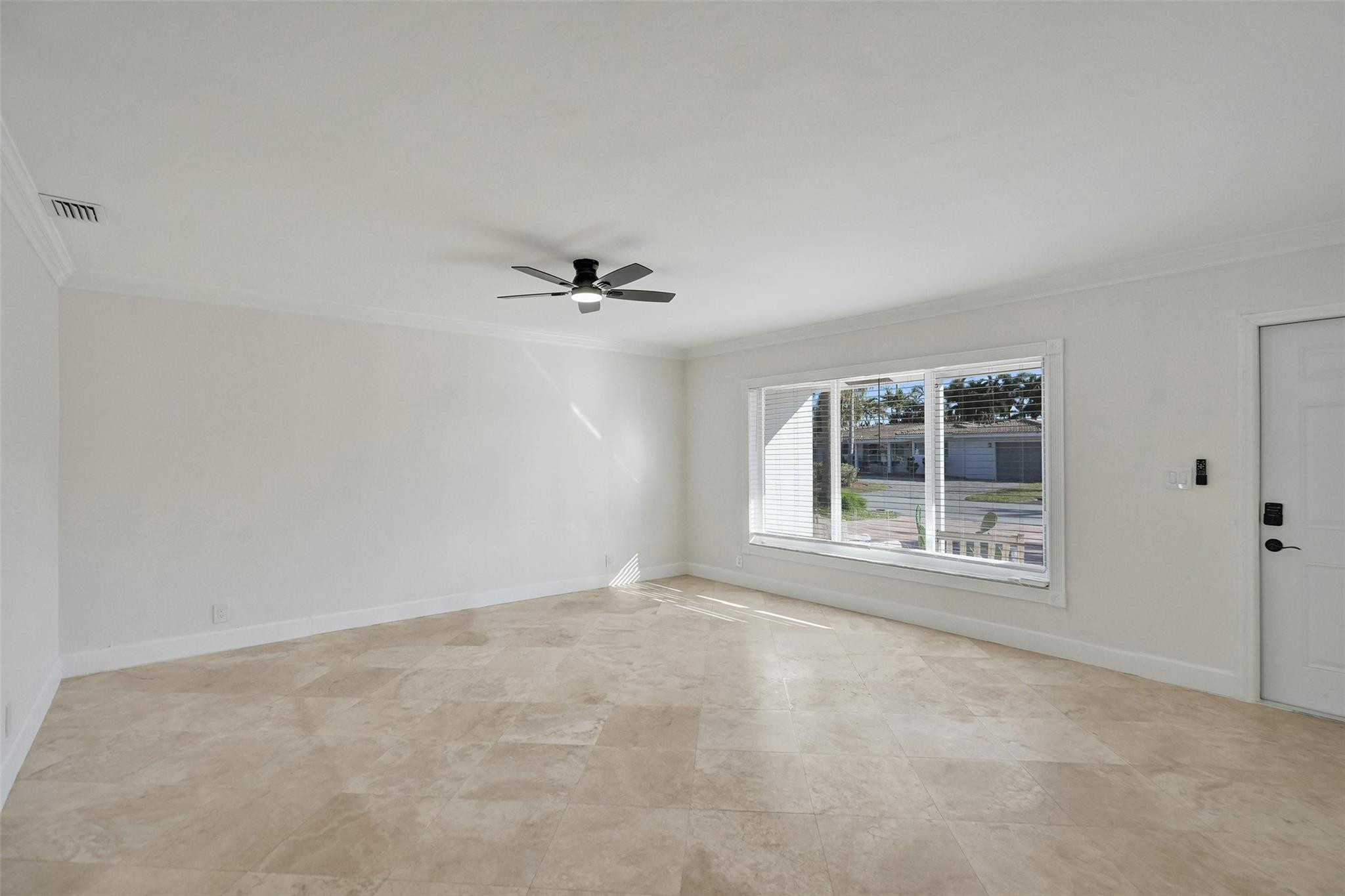2011 Northeast 34th Street Lighthouse Point, FL 33064 - Photo 12 of 47 a view of an empty room with a window