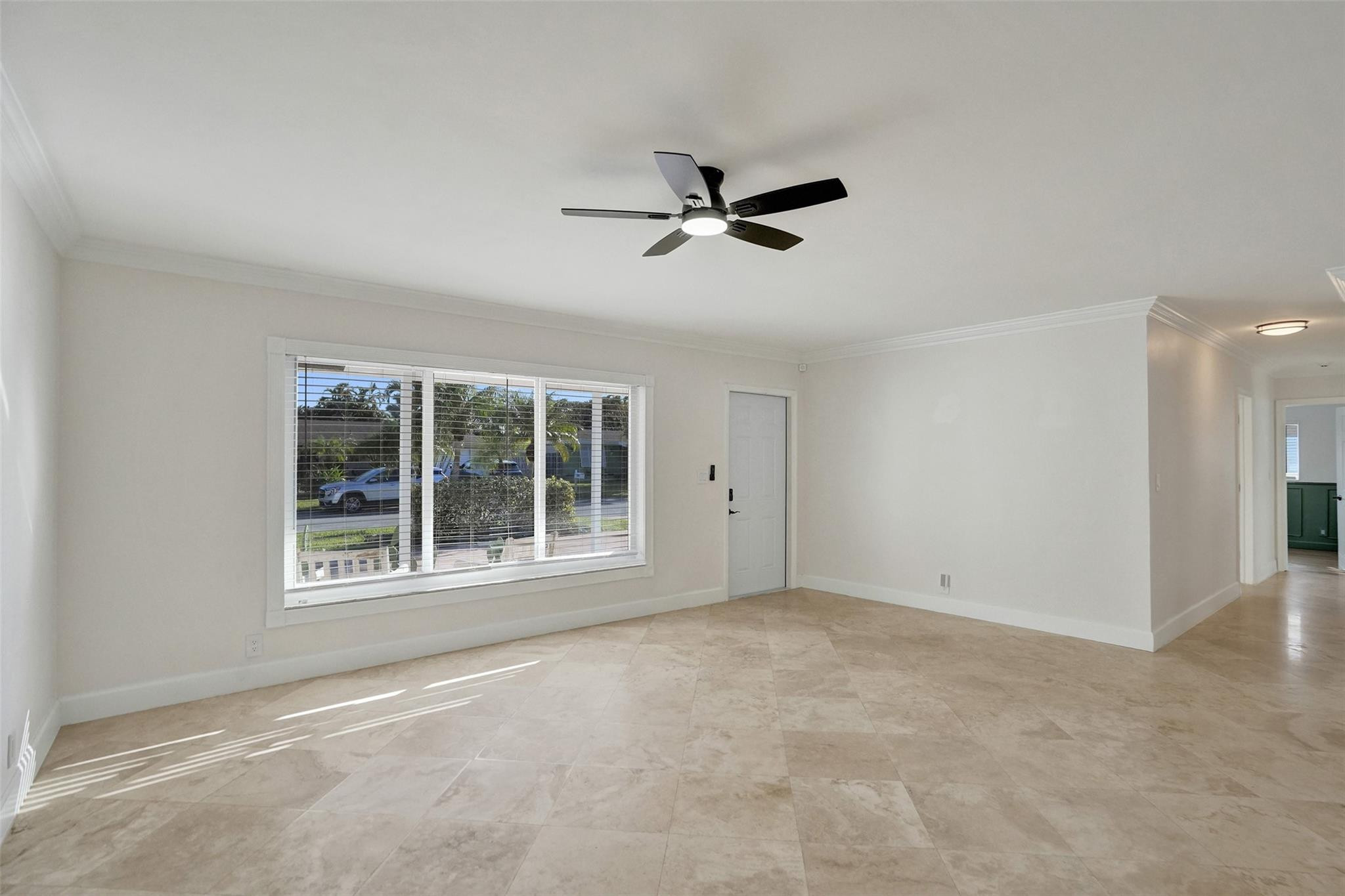 2011 Northeast 34th Street Lighthouse Point, FL 33064 - Photo 14 of 47 an empty room with a window