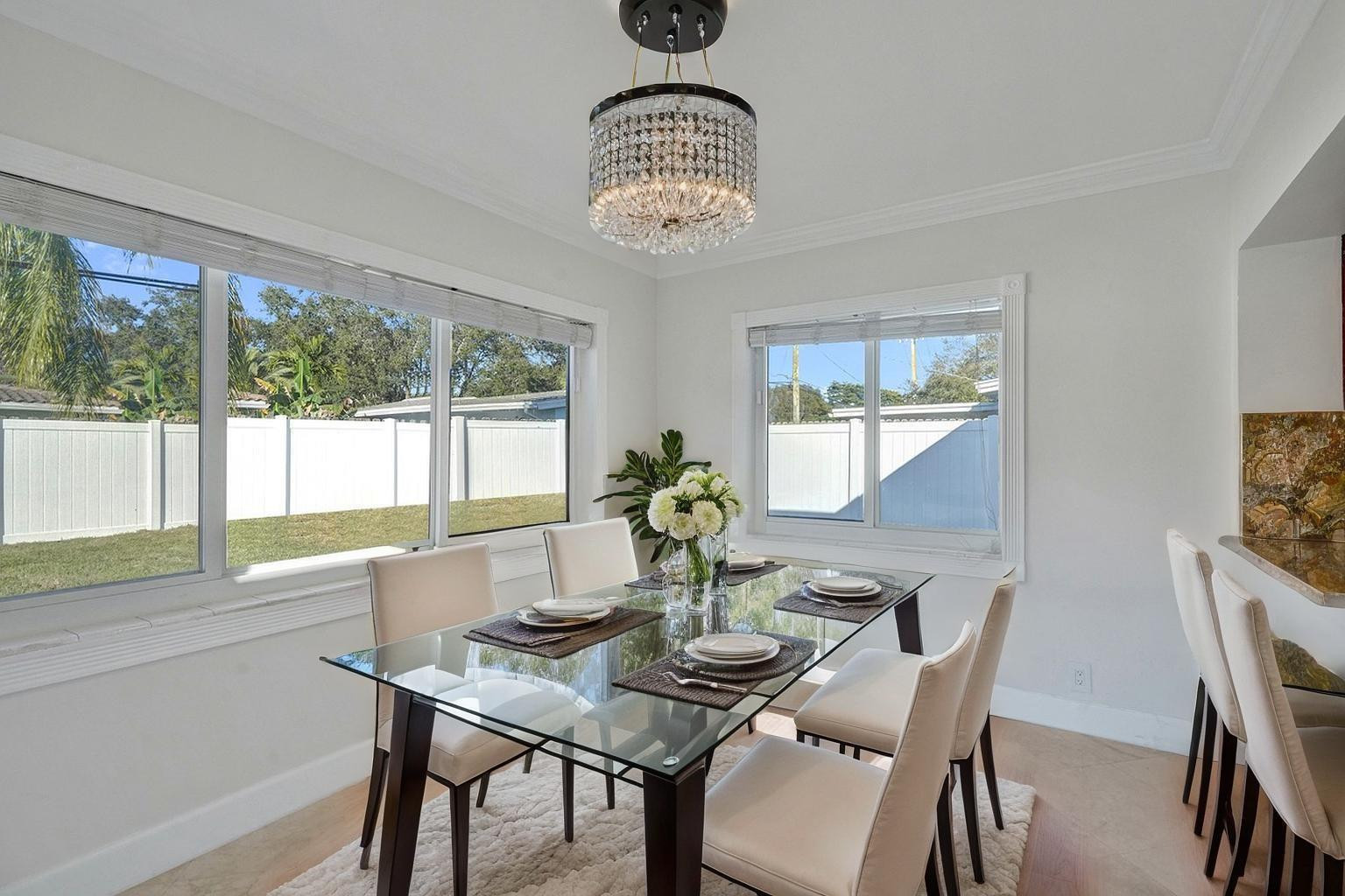 2011 Northeast 34th Street Lighthouse Point, FL 33064 - Photo 21 of 47 a view of a dining room with furniture window and outside view