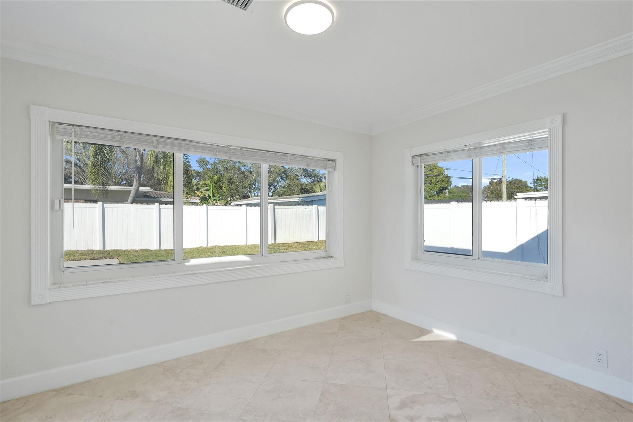 2011 Northeast 34th Street Lighthouse Point, FL 33064 - Photo 22 of 47 an empty room with a window