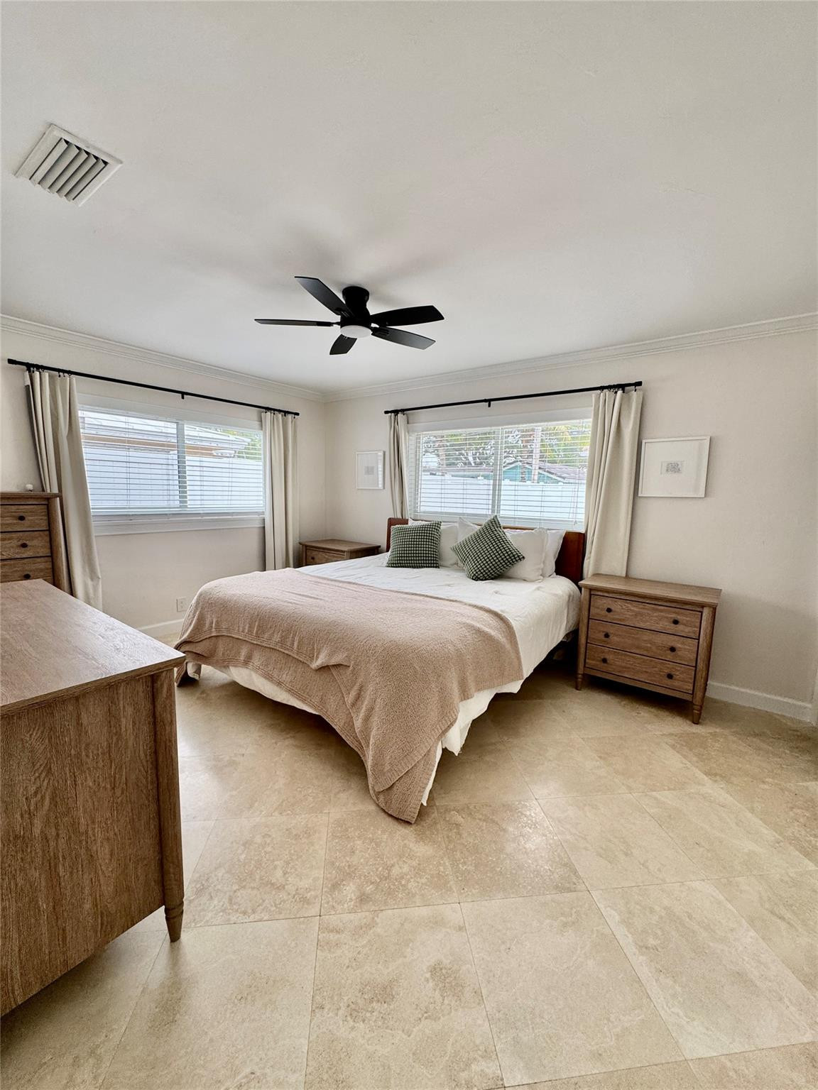 2011 Northeast 34th Street Lighthouse Point, FL 33064 - Photo 23 of 47 a bedroom with a bed and a night stand