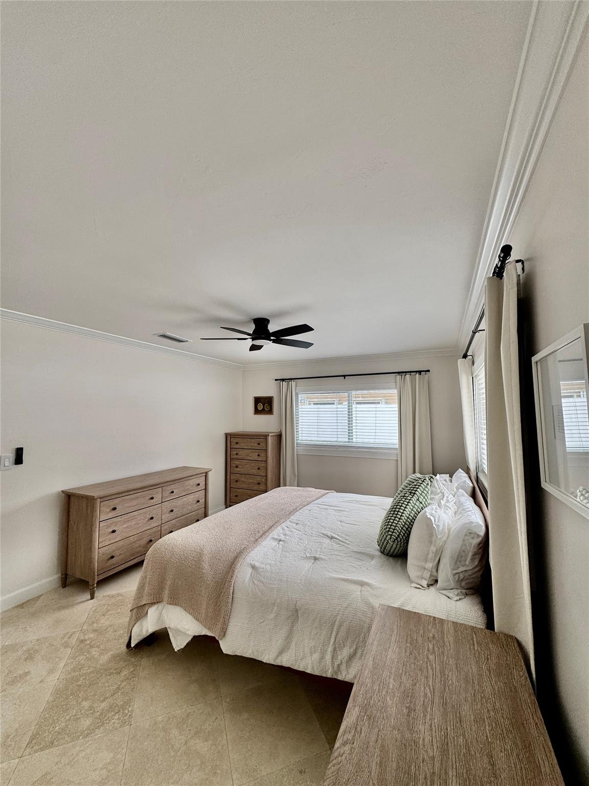 2011 Northeast 34th Street Lighthouse Point, FL 33064 - Photo 25 of 47 a bedroom with a bed and a large window