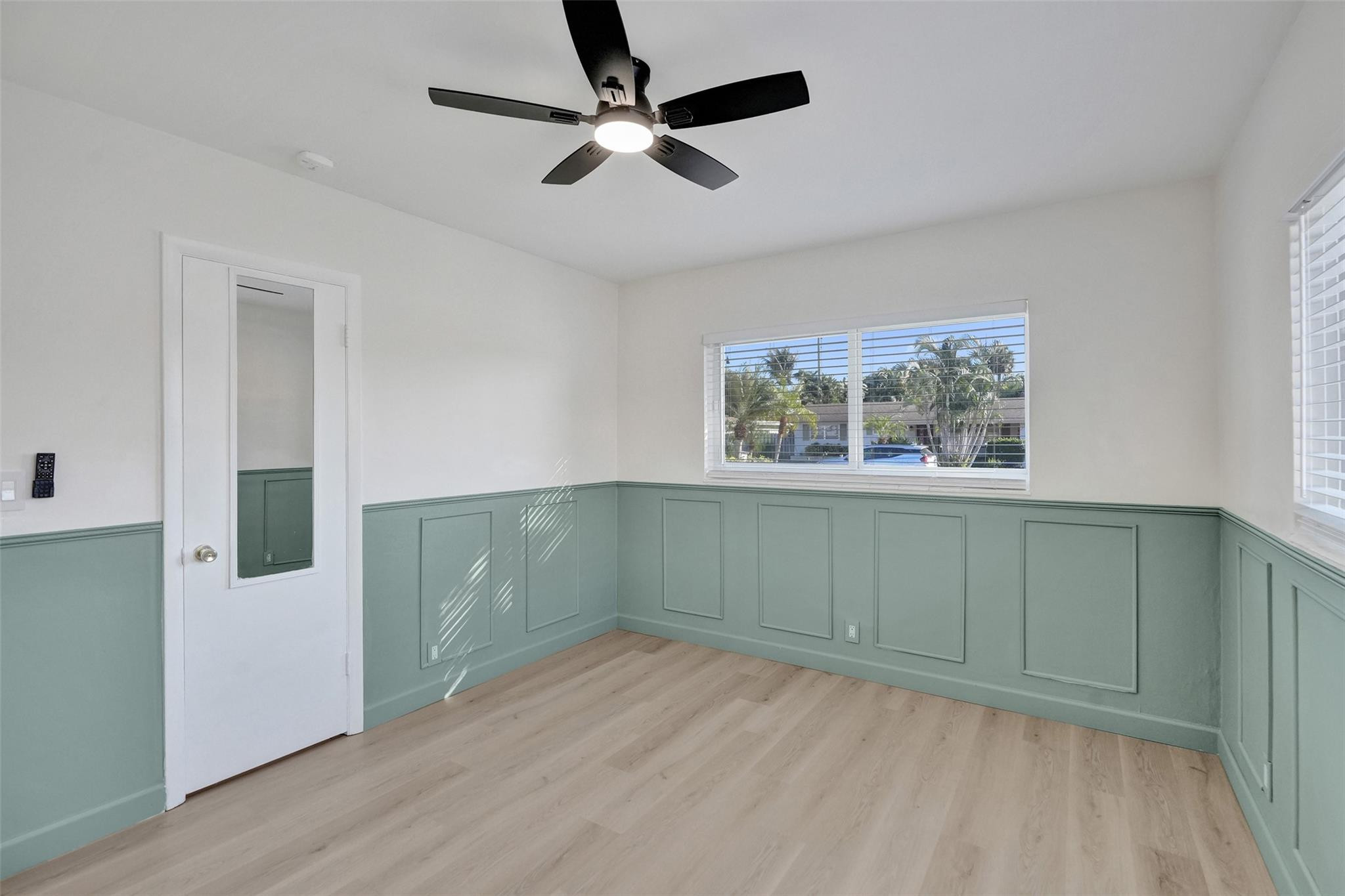 2011 Northeast 34th Street Lighthouse Point, FL 33064 - Photo 35 of 47 a view of empty room with wooden floor and fan