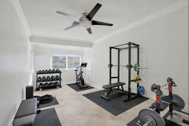 2011 Northeast 34th Street Lighthouse Point, FL 33064 - Photo 39 of 47 a room with gym equipment and a large window