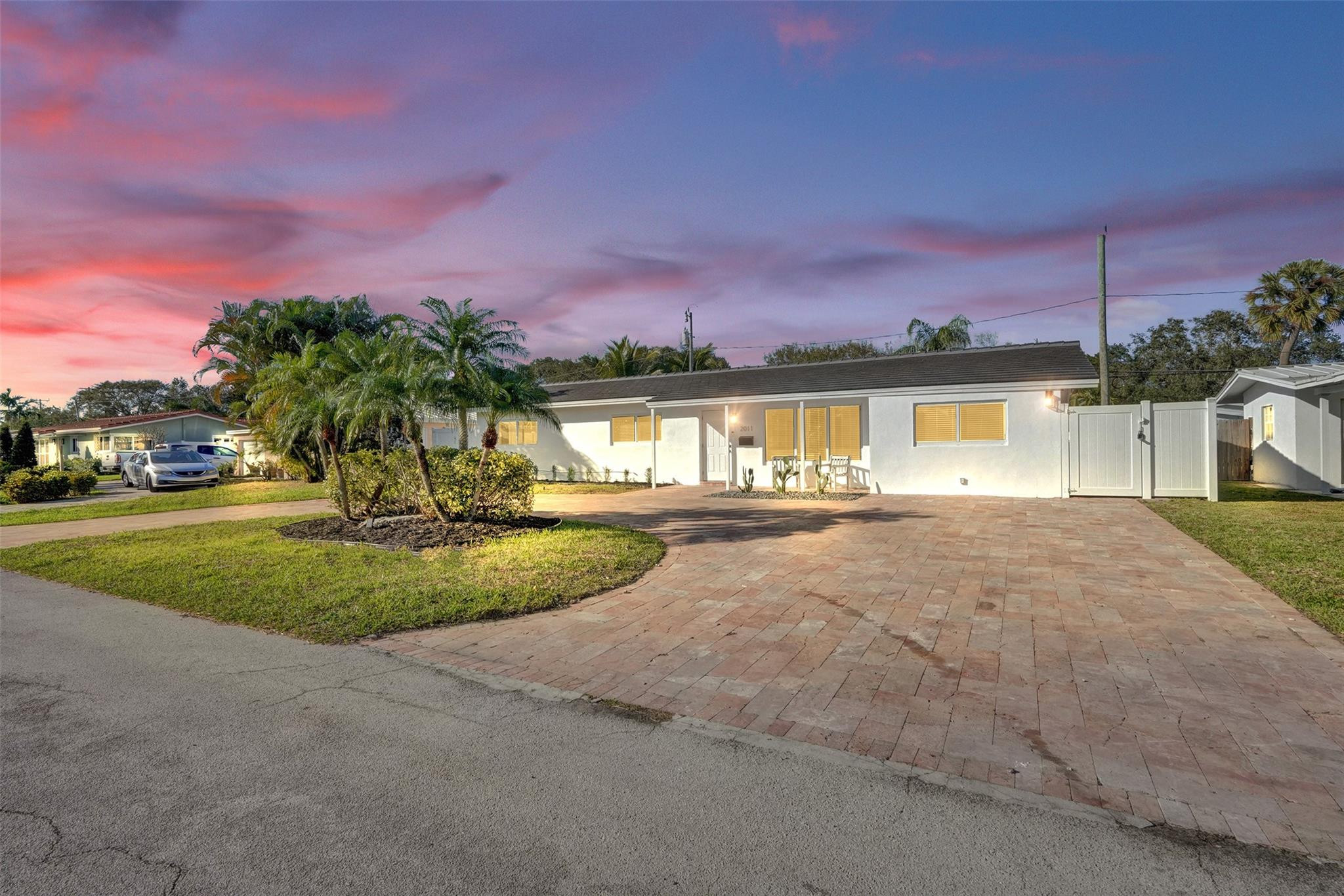 2011 Northeast 34th Street Lighthouse Point, FL 33064 - Photo 4 of 47 a view of a swimming pool with a yard and a fountain