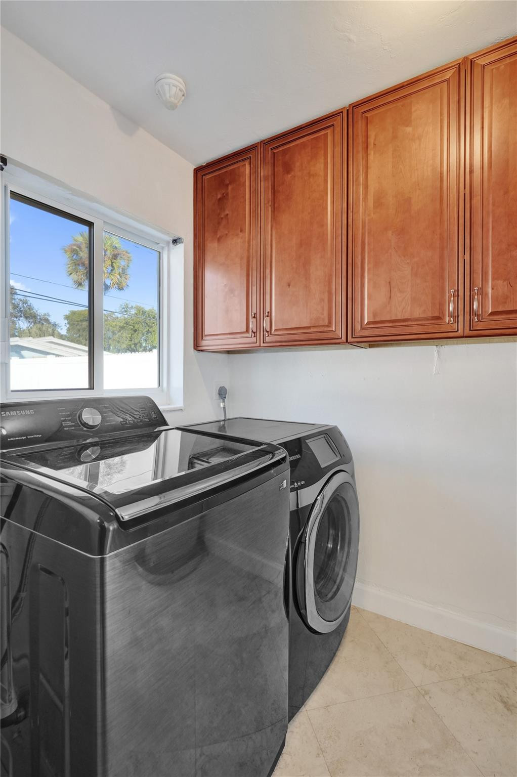 2011 Northeast 34th Street Lighthouse Point, FL 33064 - Photo 46 of 47 a utility room with washer and dryer