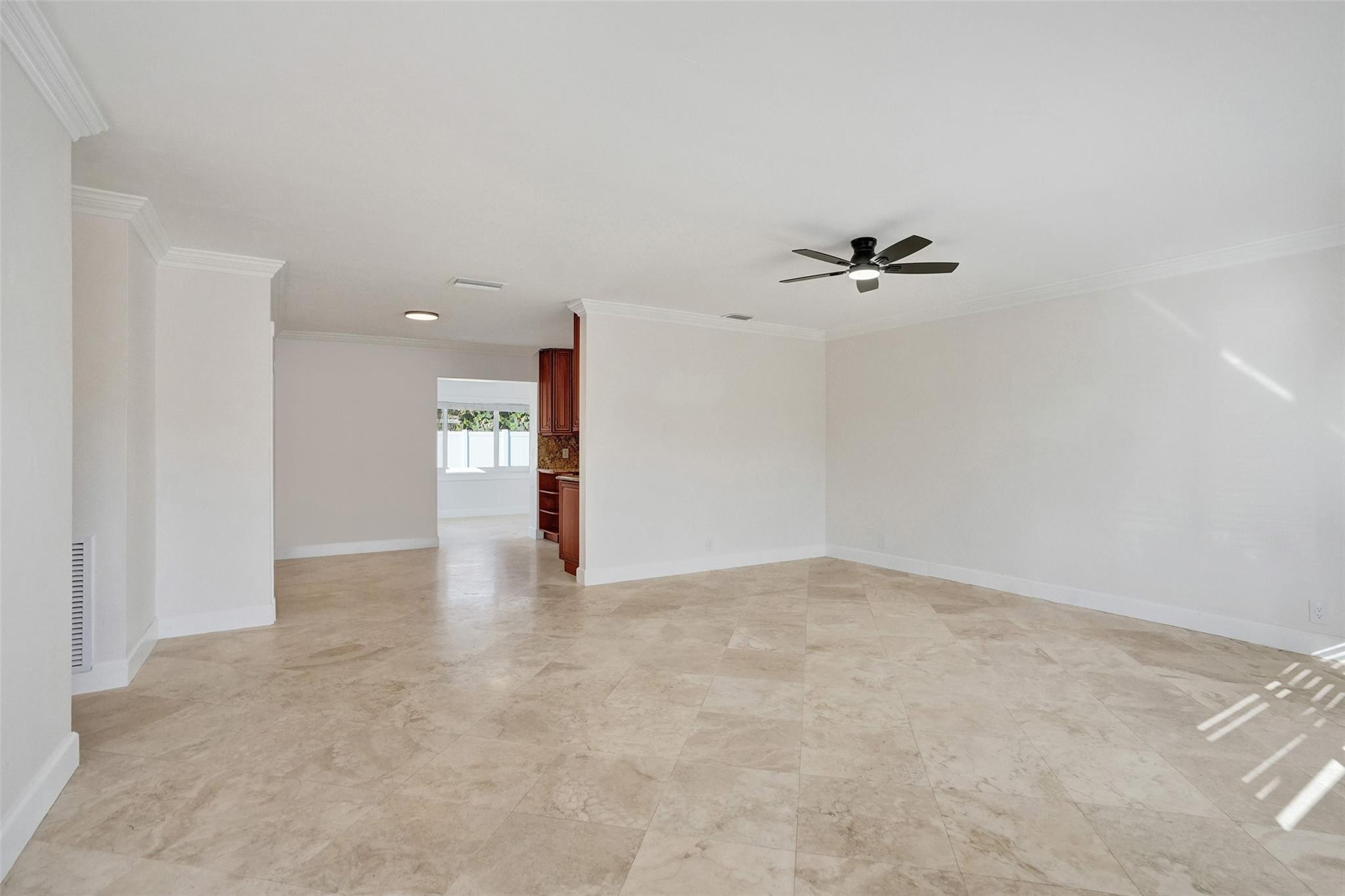 2011 Northeast 34th Street Lighthouse Point, FL 33064 - Photo 9 of 47 a view of a room with a ceiling fan