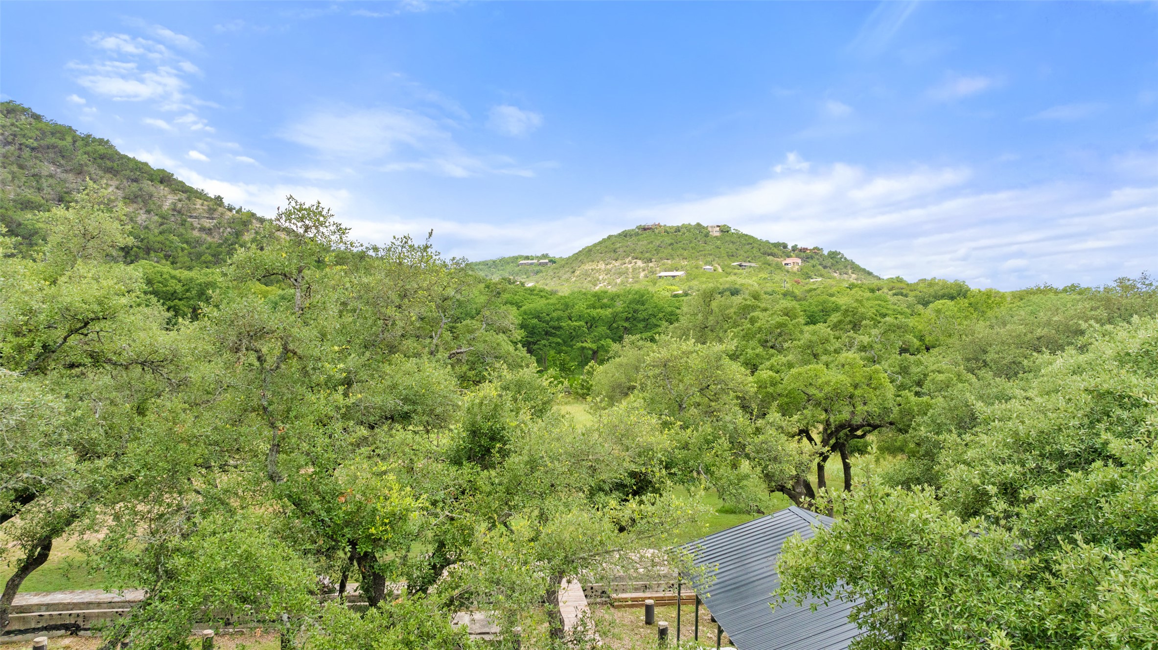 200 Rim Road Wimberley, TX 78676 - Photo 10 of 25 This lot is private and amazing hill views and trees along with ultimate waterfrontage.