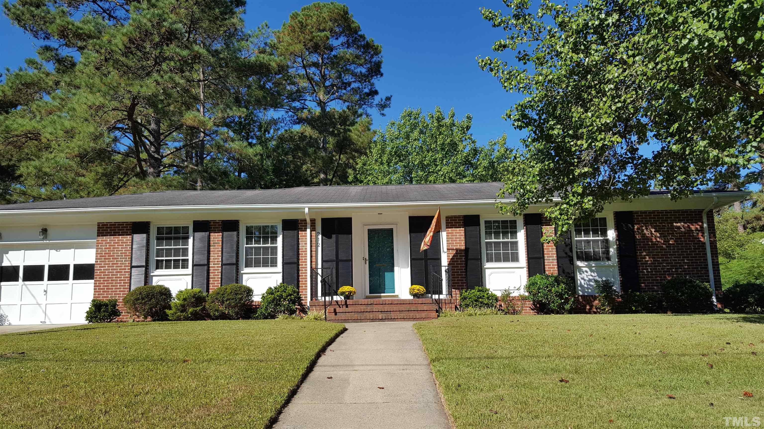 212 Longview Drive Smithfield, NC 27577 - Photo 2 of 15 front view of a house with a garden