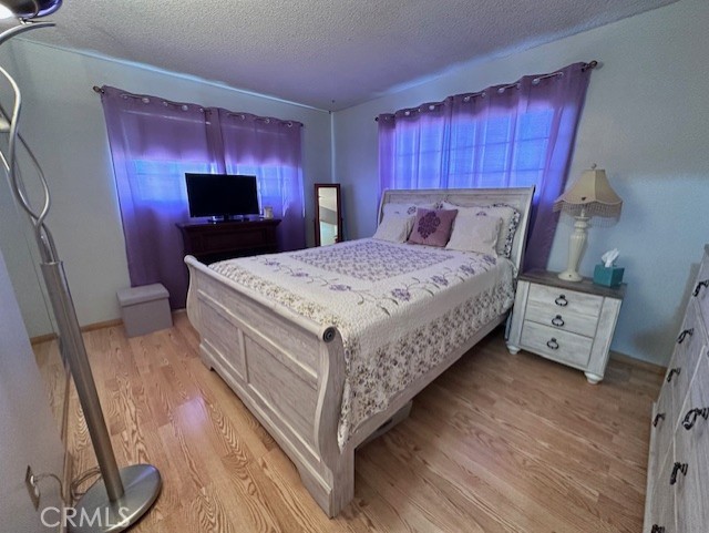 25478 Ash Road Barstow, CA 92311 - Photo 13 of 35 a bed room with a bed and a television