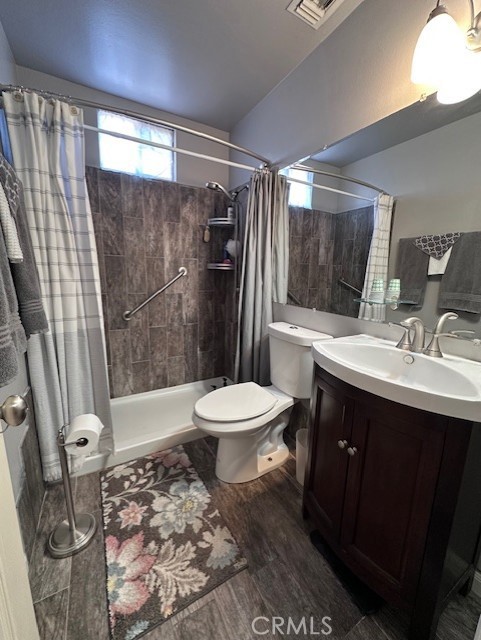 25478 Ash Road Barstow, CA 92311 - Photo 14 of 35 a bathroom with a sink toilet and shower