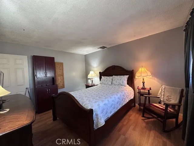 a bedroom with bed and window