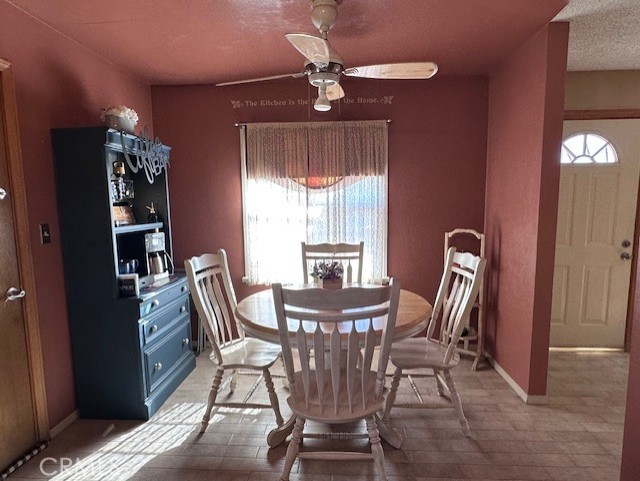 25478 Ash Road Barstow, CA 92311 - Photo 24 of 35 a view of a dining room with furniture window and outside view