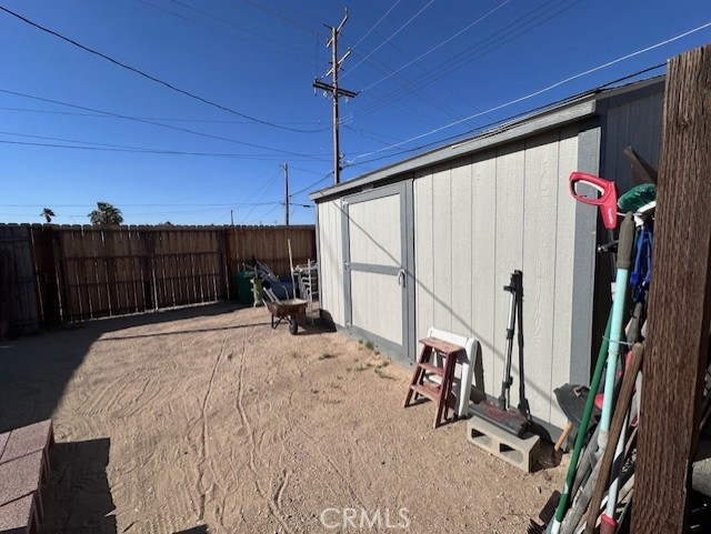 25478 Ash Road Barstow, CA 92311 - Photo 33 of 35 a view of a bedroom with gym equipment