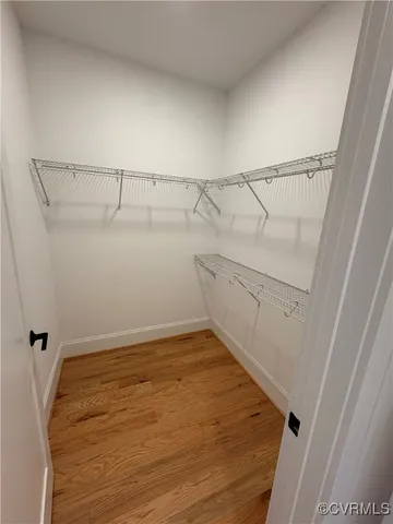 view of a bathroom with a sink and mirror