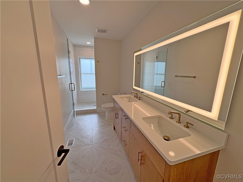 3215 Stuart Avenue, Unit 30 Richmond, VA 23221 - Photo 18 of 28 view of a bathroom with a sink and mirror