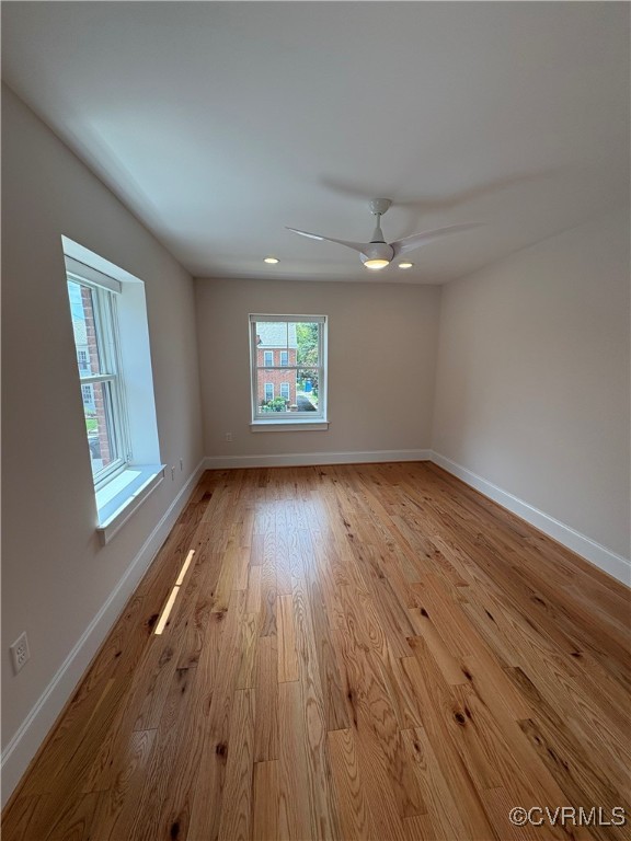 3215 Stuart Avenue, Unit 30 Richmond, VA 23221 - Photo 23 of 28 an empty room with wooden floor and windows