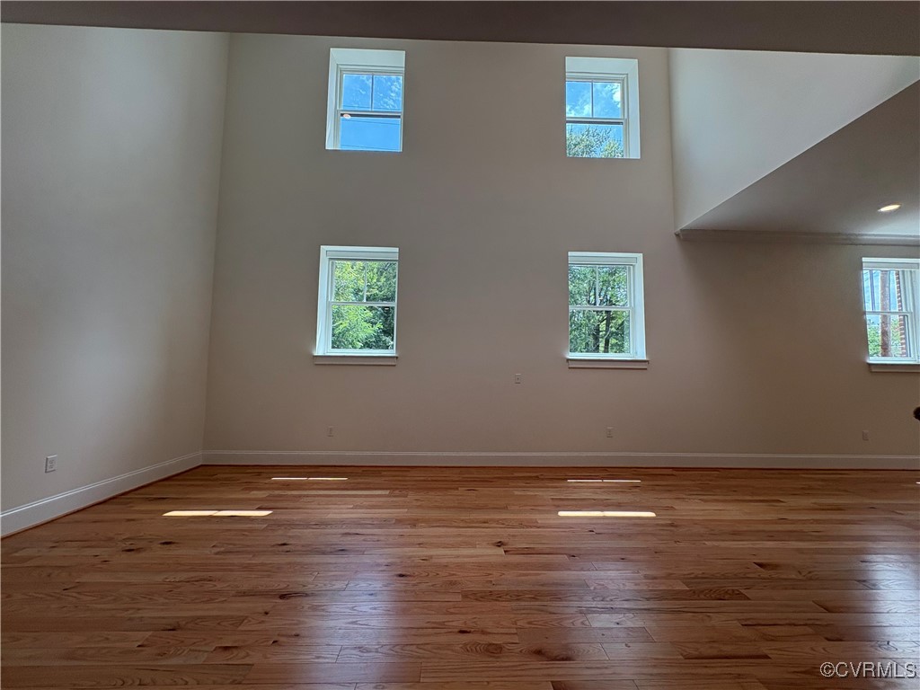 3215 Stuart Avenue, Unit 30 Richmond, VA 23221 - Photo 6 of 28 a view of a room with wooden floor and window