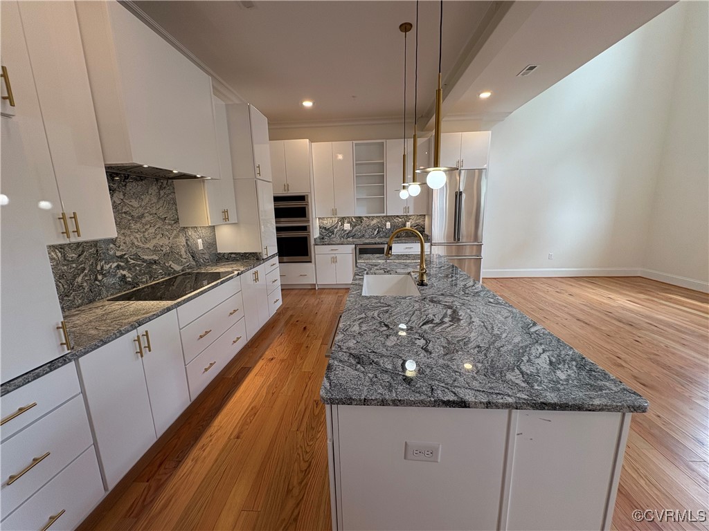 3215 Stuart Avenue, Unit 30 Richmond, VA 23221 - Photo 8 of 28 a kitchen with stainless steel appliances granite countertop a sink stove and cabinets