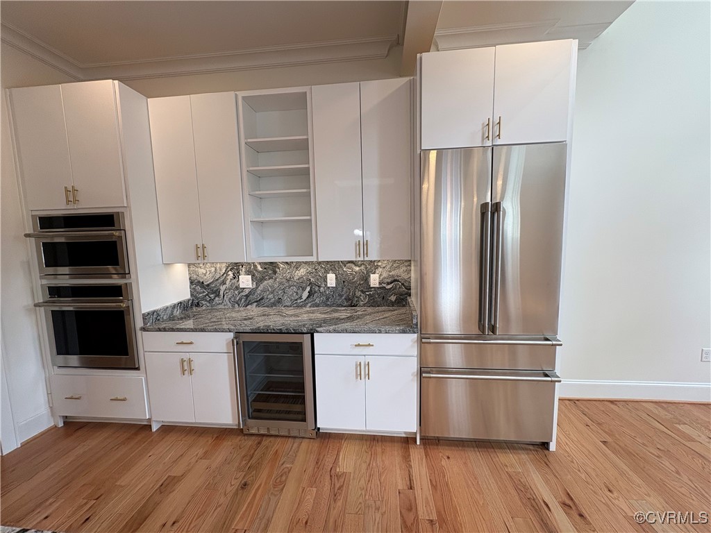 3215 Stuart Avenue, Unit 30 Richmond, VA 23221 - Photo 9 of 28 Kitchen has double ovens, wine fridge, open shelvi