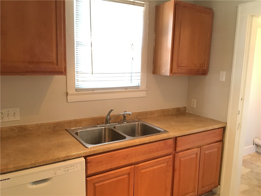 812 East 30th Street Austin, TX 78705 - Photo 12 of 16 a kitchen with a sink and cabinets