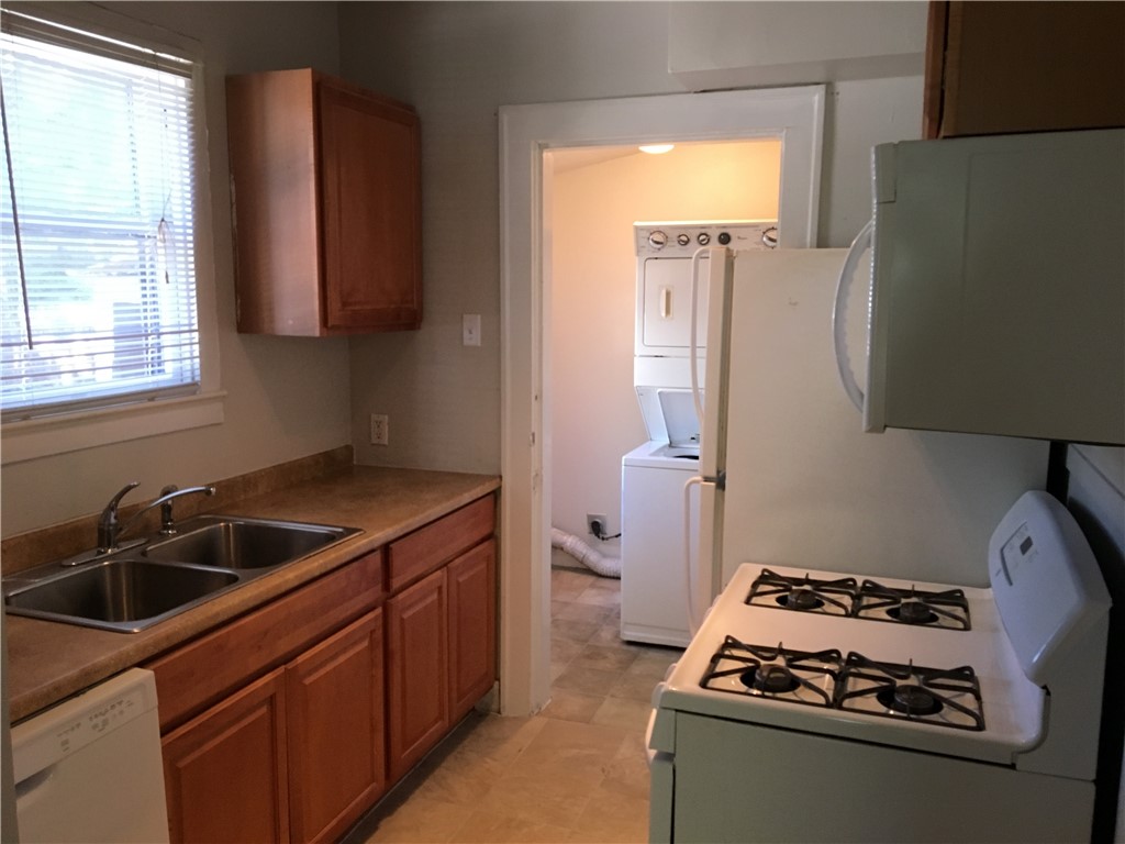 812 East 30th Street Austin, TX 78705 - Photo 13 of 16 a kitchen with sink a stove and a refrigerator