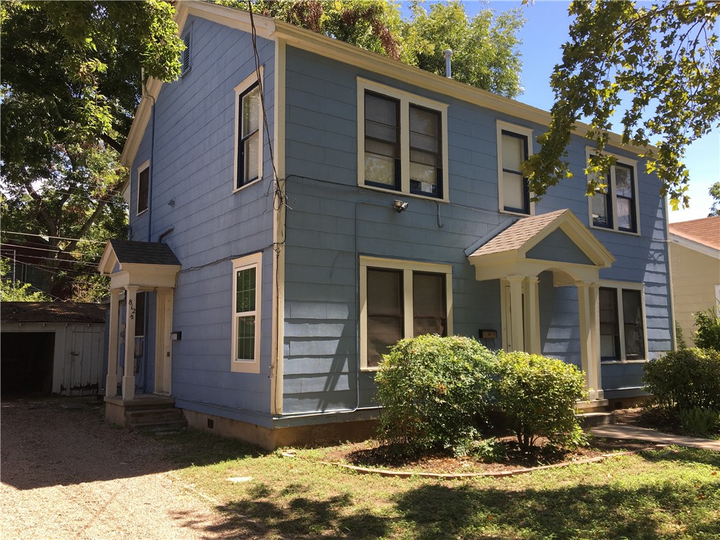 812 East 30th Street Austin, TX 78705 - Photo 2 of 16 a front view of a house with a yard