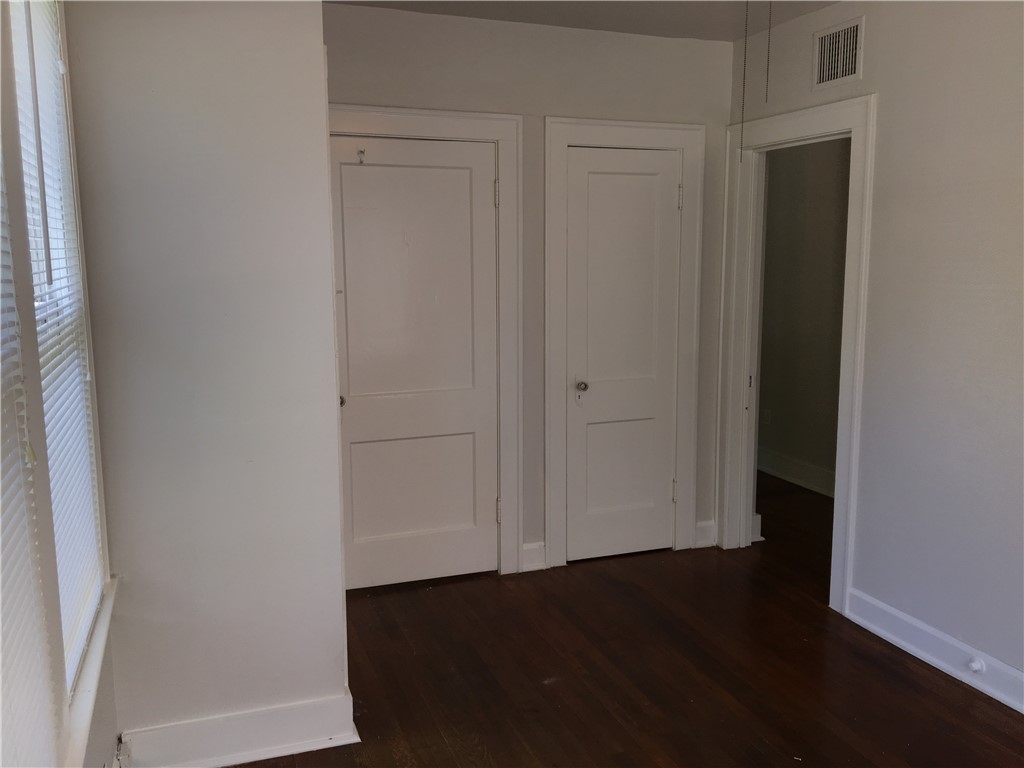 812 East 30th Street Austin, TX 78705 - Photo 8 of 16 an empty room with wooden floor