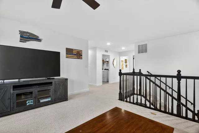 a view of livingroom with furniture and flat screen tv