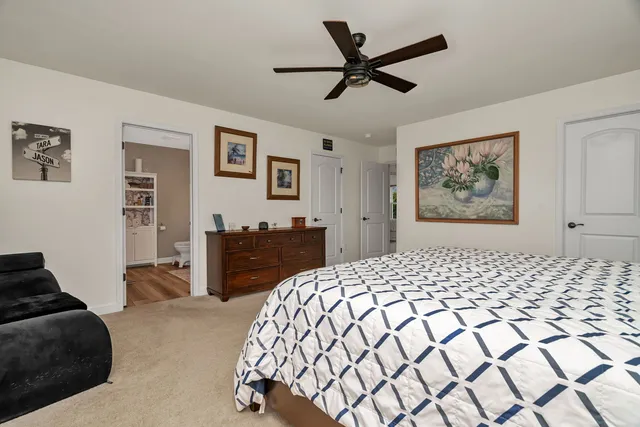 a bedroom with a bed and a dresser