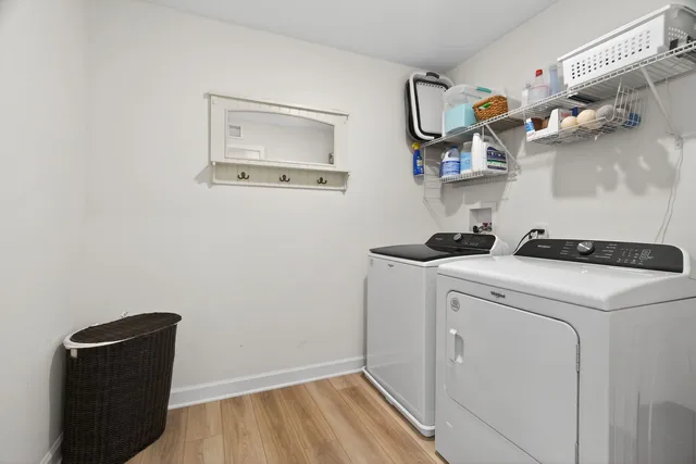 a view of storage and utility room with washer and dryer