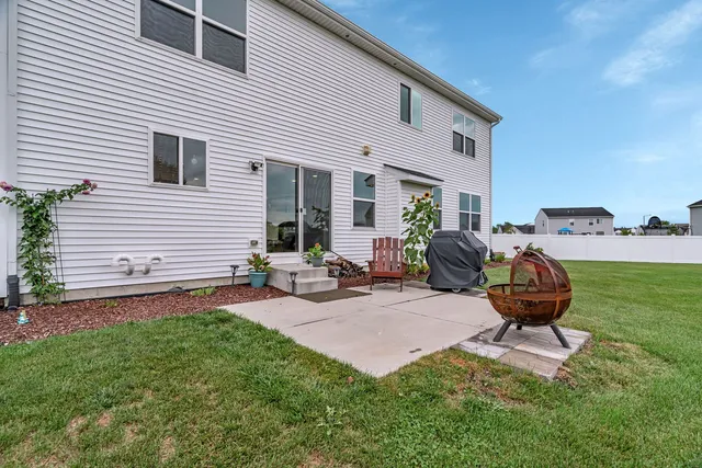 a view of a backyard with furniture