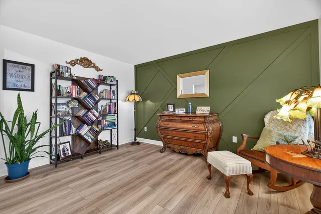 a room with furniture and wooden floor