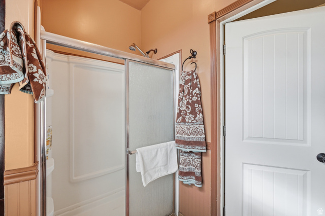 5264 West 5500th Street South Hooper, UT 84315 - Photo 24 of 38 Shower enclosure with a chrome frame and textured glass sliding door