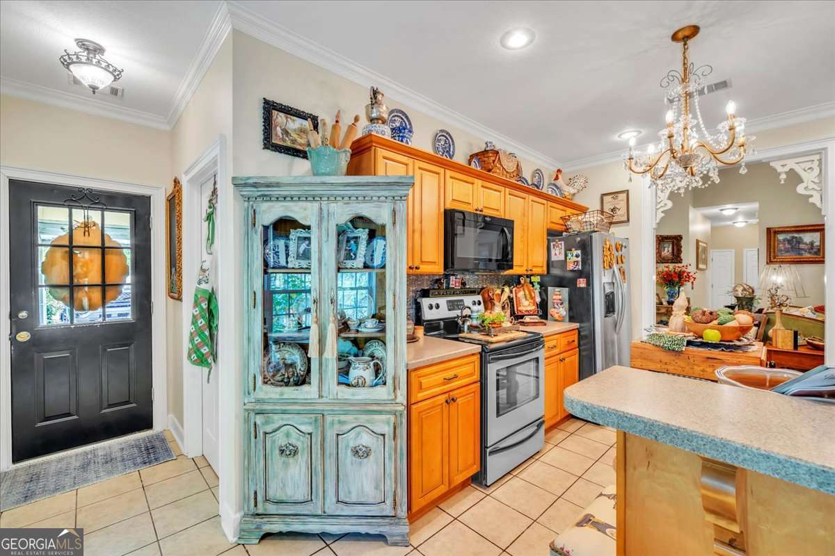 153 Landing Road Cordele, GA 31015 - Photo 12 of 62 a view of a kitchen with furniture and chandelier