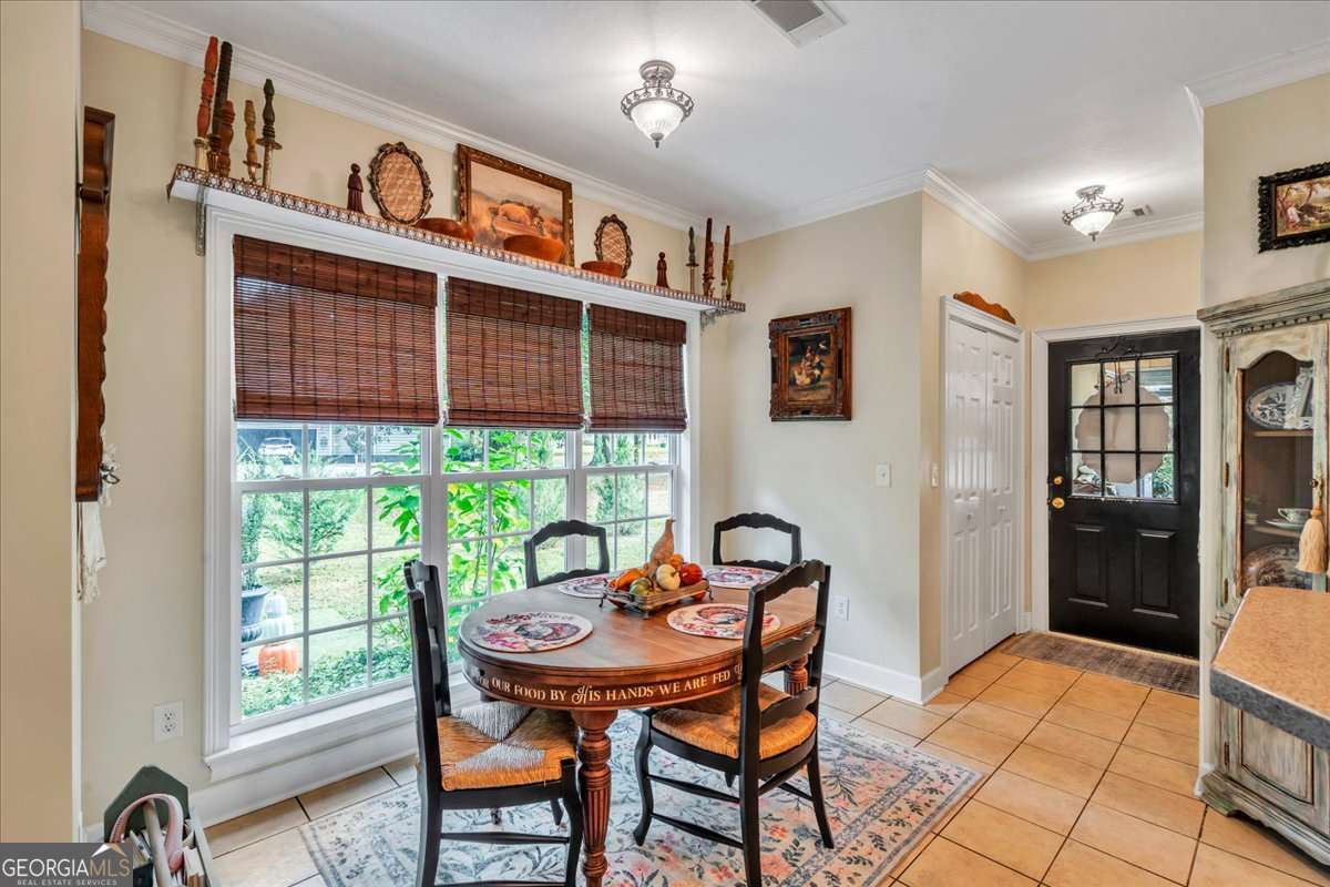 153 Landing Road Cordele, GA 31015 - Photo 14 of 62 a view of a dining room with furniture window and outside view