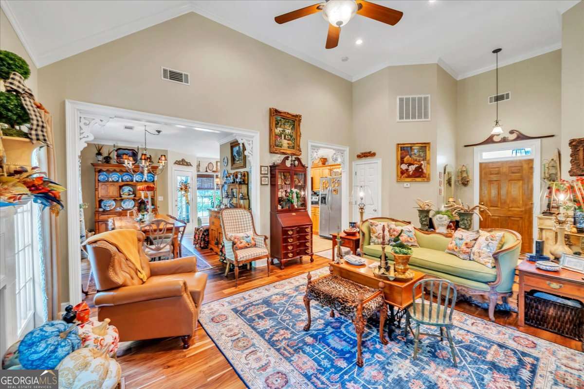 153 Landing Road Cordele, GA 31015 - Photo 18 of 62 a living room with patio furniture and a chandelier