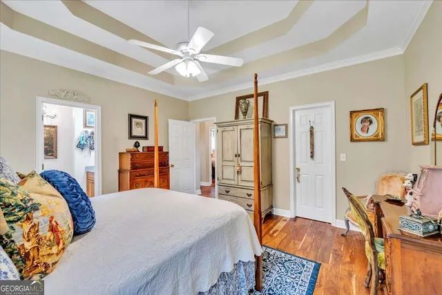 a bed room with a bed and a chandelier
