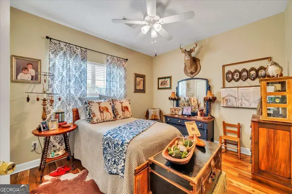 a bed room with a bed and mirror